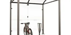 Modulare Fahrradüberdachung Vierkantrohr „M” mit 8 mm ESG-Glasverkleidungen und gewölbtem Polycarbonatdach auf Bodenplatten